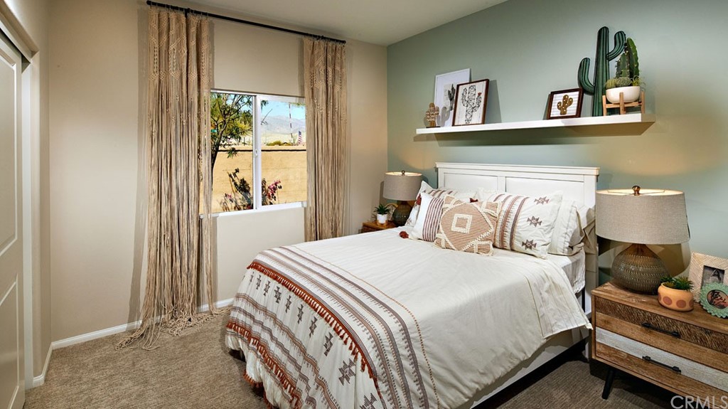 44431 Beringer Drive Indio, CA 92203 - Photo 8 of 17 a bedroom with a bed and window