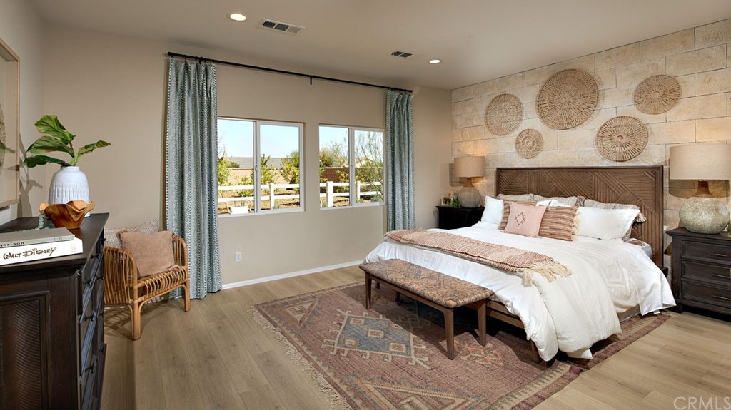 44431 Beringer Drive Indio, CA 92203 - Photo 10 of 17 a bedroom with a bed and a table