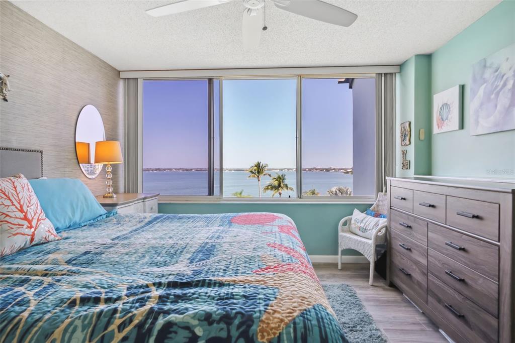 5151 Isla Key Boulevard South, Unit 421 St. Petersburg, FL 33715 - Photo 24 of 61 a bedroom with a bed and a dresser