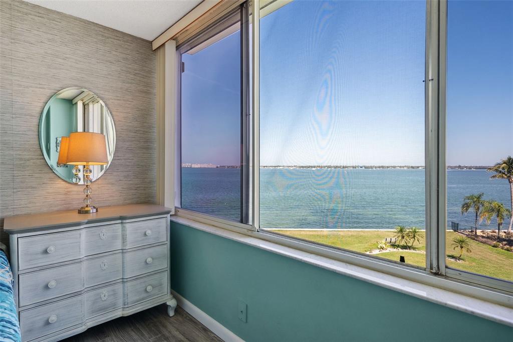 5151 Isla Key Boulevard South, Unit 421 St. Petersburg, FL 33715 - Photo 25 of 61 a bathroom with a large tub sink and mirror