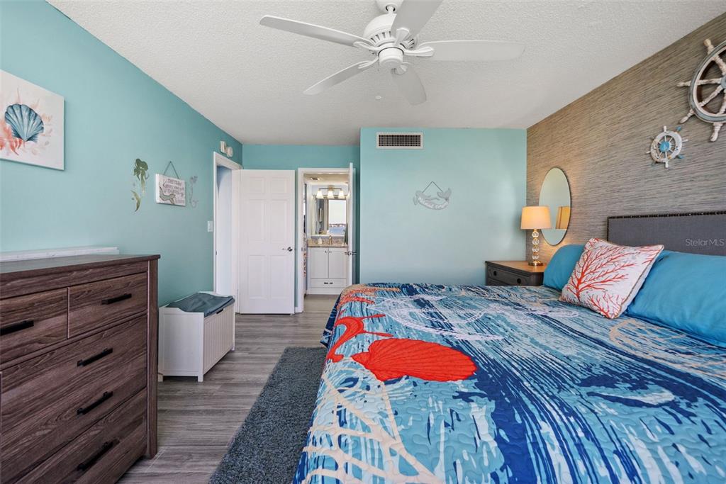 5151 Isla Key Boulevard South, Unit 421 St. Petersburg, FL 33715 - Photo 26 of 61 a bed room with a bed and a lamp