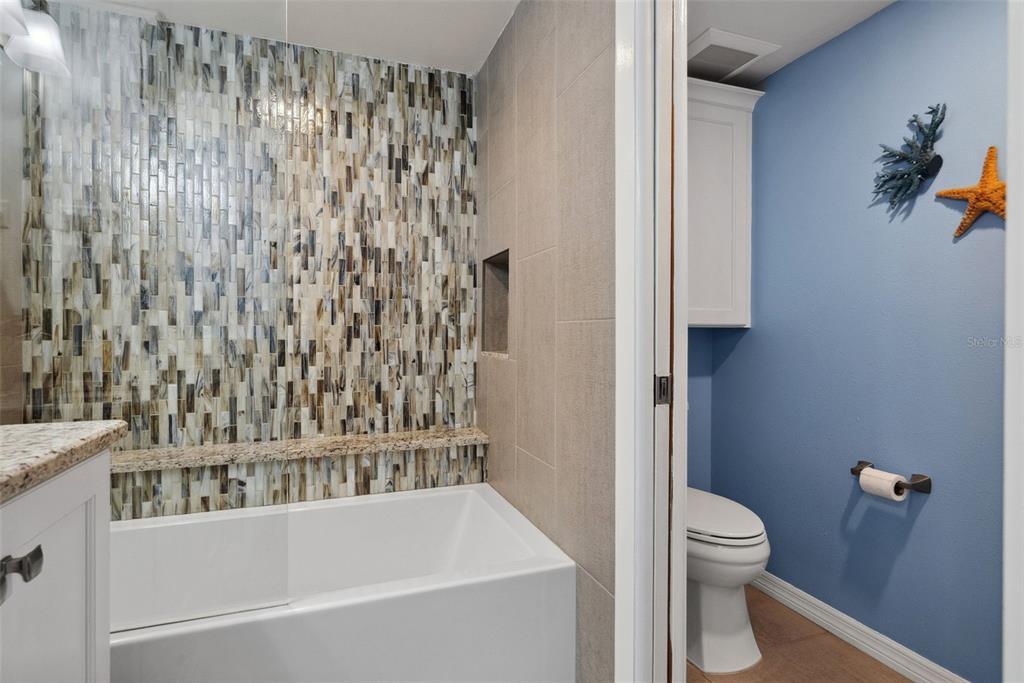 5151 Isla Key Boulevard South, Unit 421 St. Petersburg, FL 33715 - Photo 30 of 61 a bathroom with a bathtub and shower