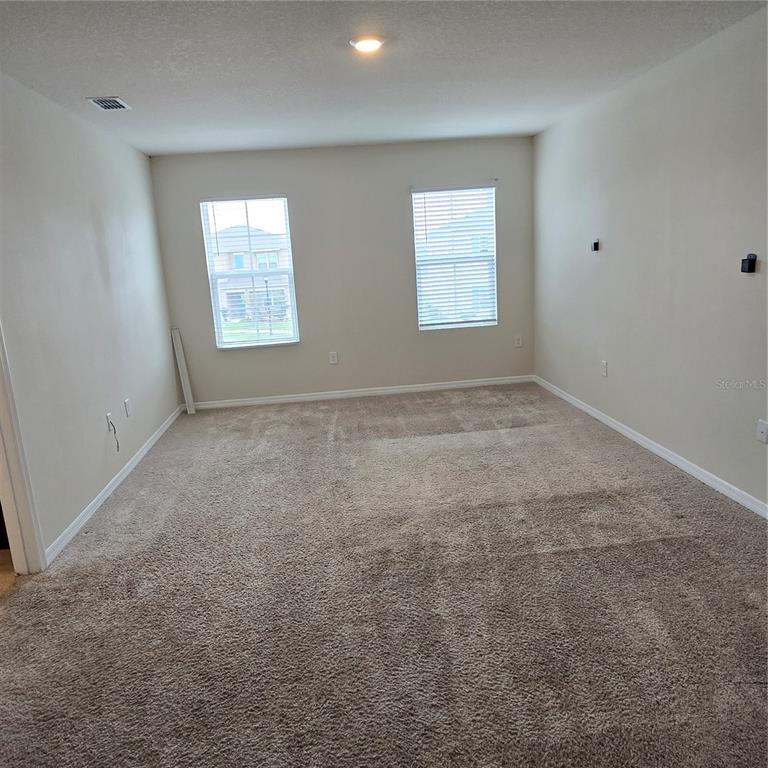 814 Sun Burst Road Winter Haven, FL 33880 - Photo 33 of 48 an empty room with windows
