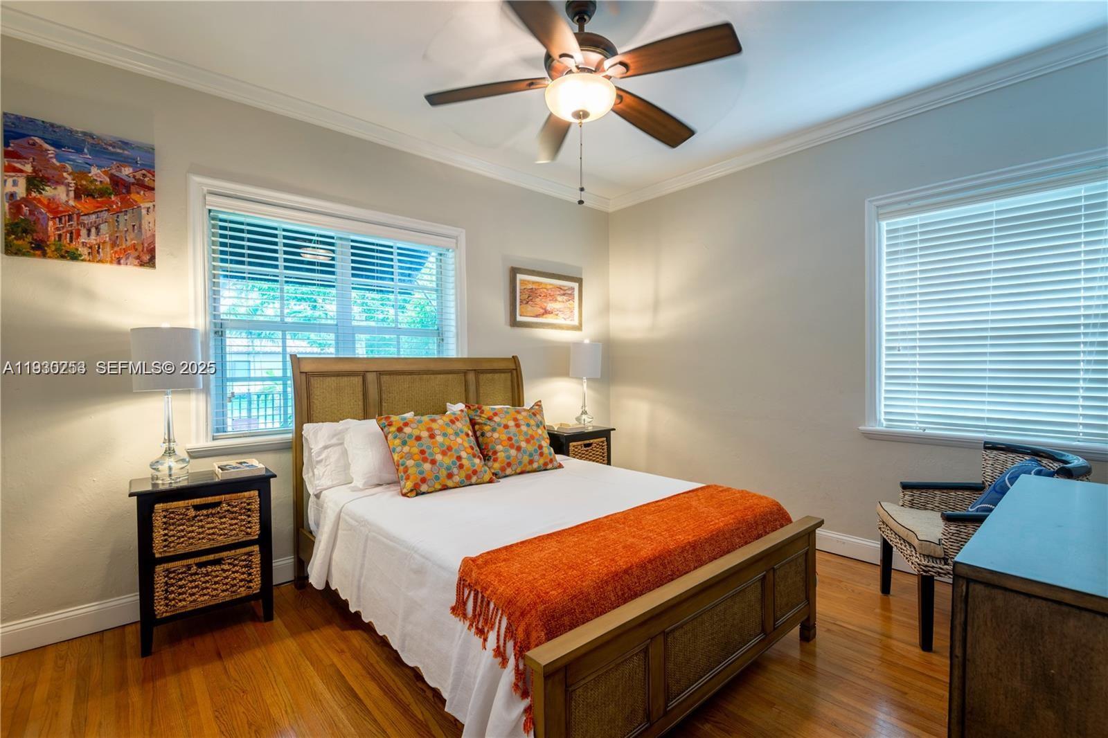 2308 Southwest 23rd Terrace Miami, FL 33145 - Photo 13 of 27 a bedroom with a bed and a window