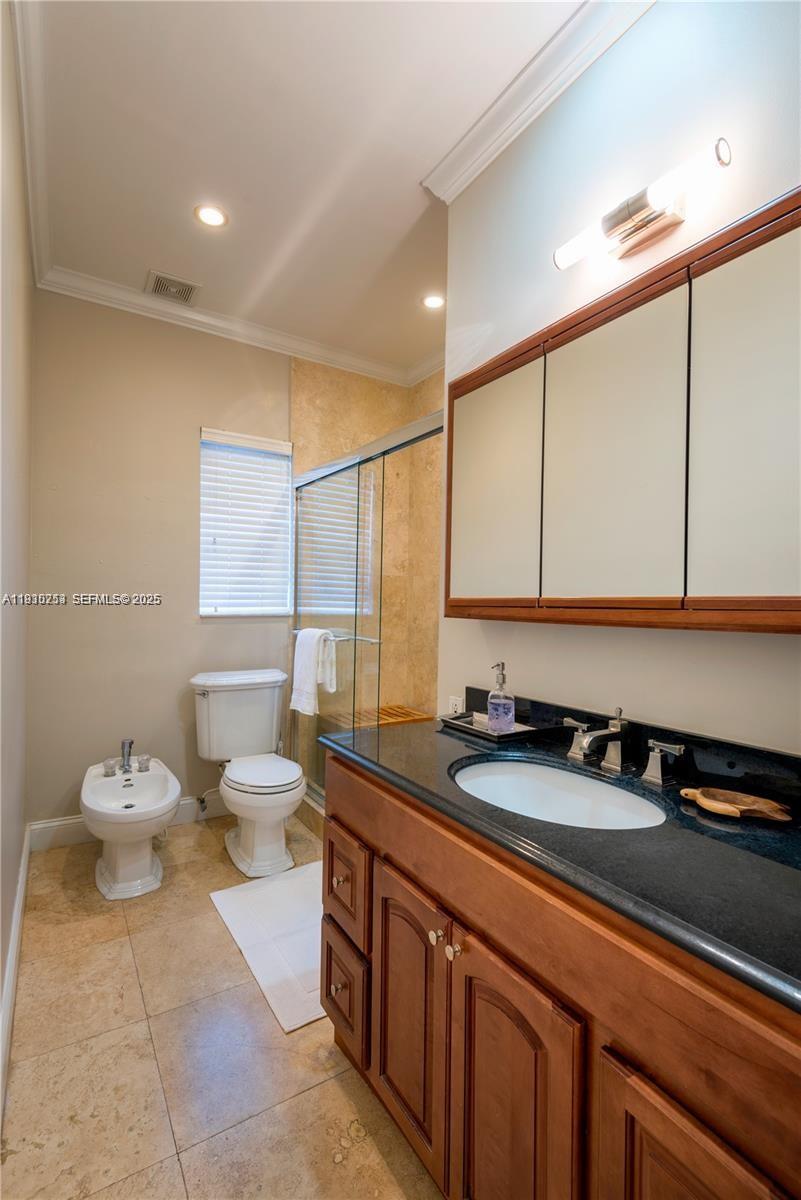 2308 Southwest 23rd Terrace Miami, FL 33145 - Photo 15 of 27 a bathroom with a sink a toilet and mirror