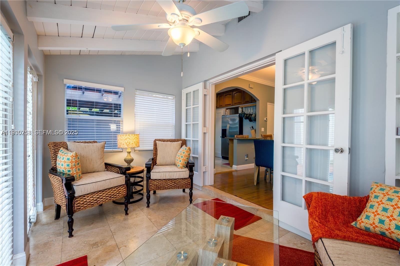 2308 Southwest 23rd Terrace Miami, FL 33145 - Photo 20 of 27 a living room with furniture a chandelier and a rug