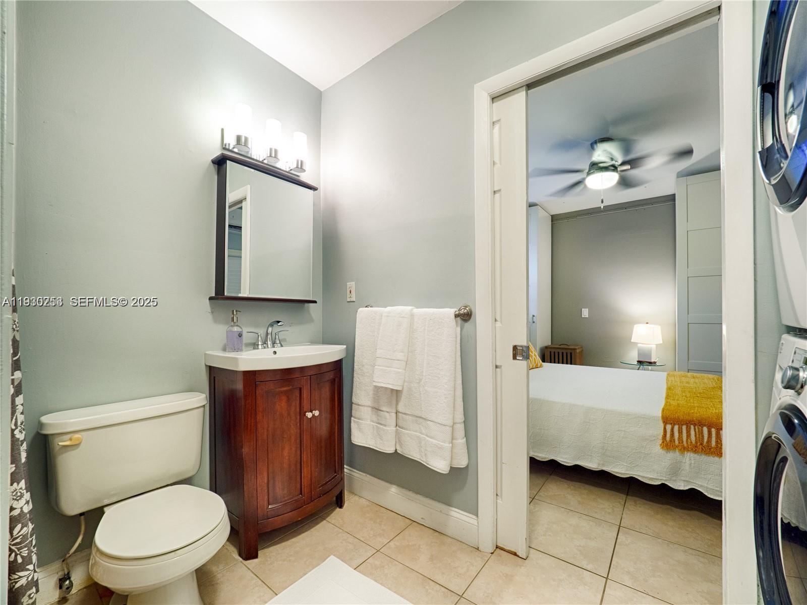 2308 Southwest 23rd Terrace Miami, FL 33145 - Photo 22 of 27 a bathroom with a toilet sink and mirror