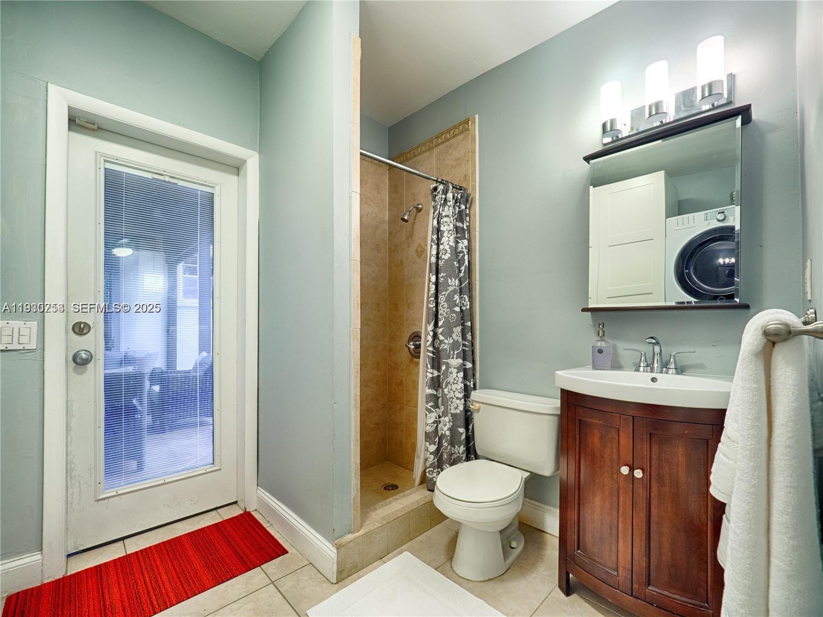 2308 Southwest 23rd Terrace Miami, FL 33145 - Photo 23 of 27 a bathroom with a toilet a sink and shower