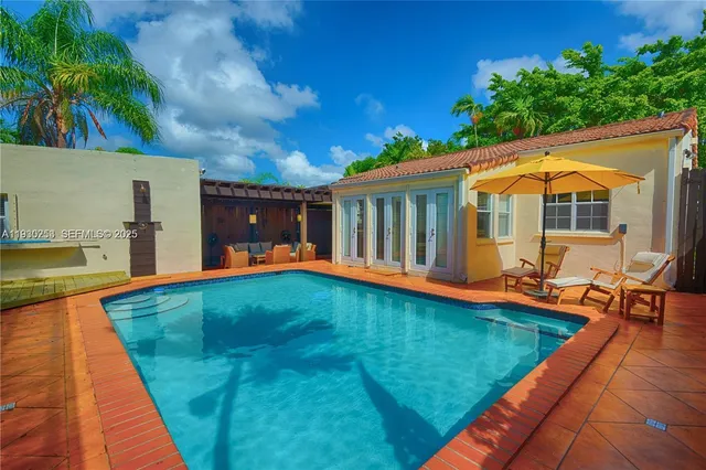 a view of swimming pool with lounge chair
