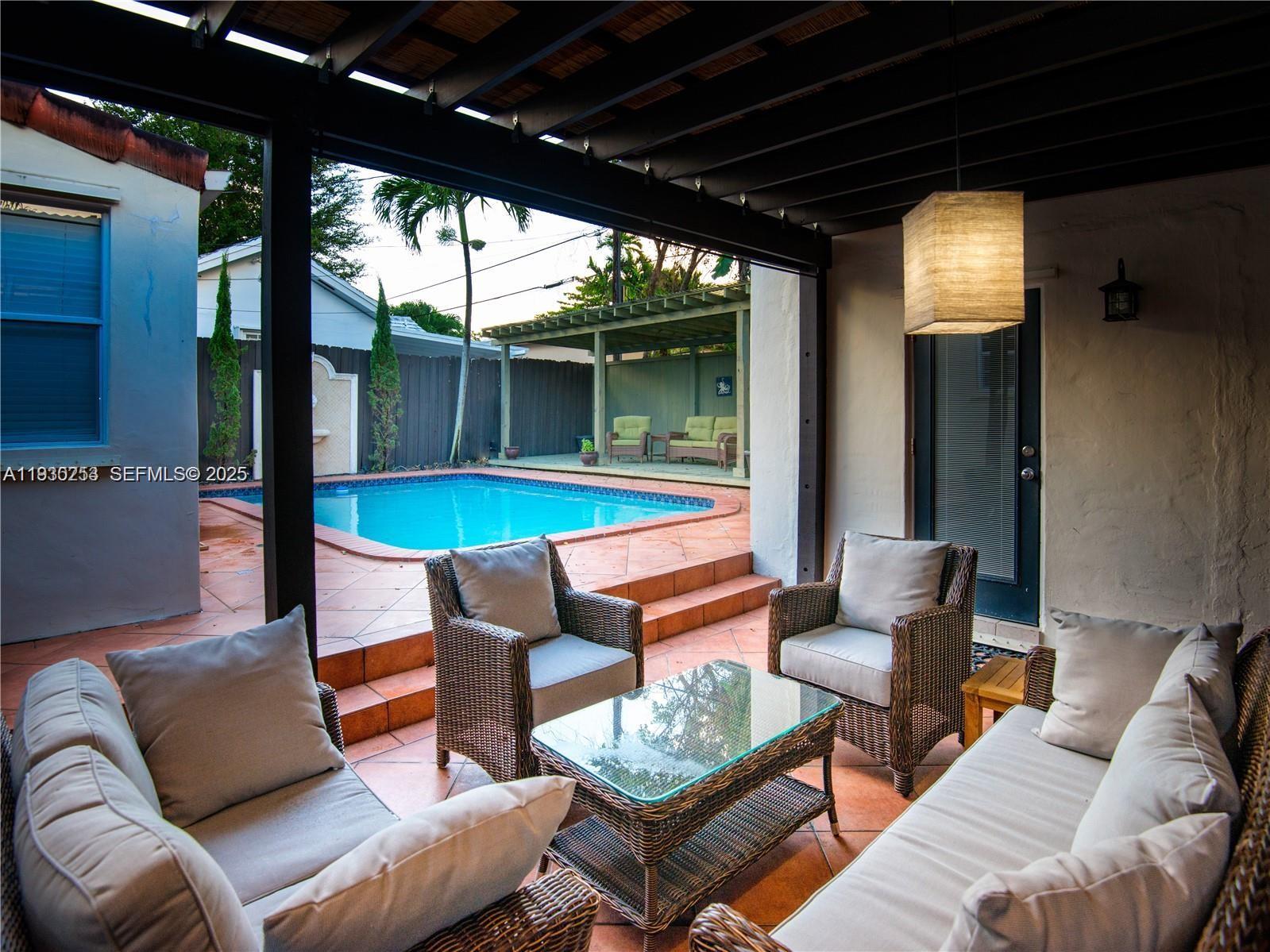 2308 Southwest 23rd Terrace Miami, FL 33145 - Photo 25 of 27 a outdoor living space with patio furniture and a potted plants