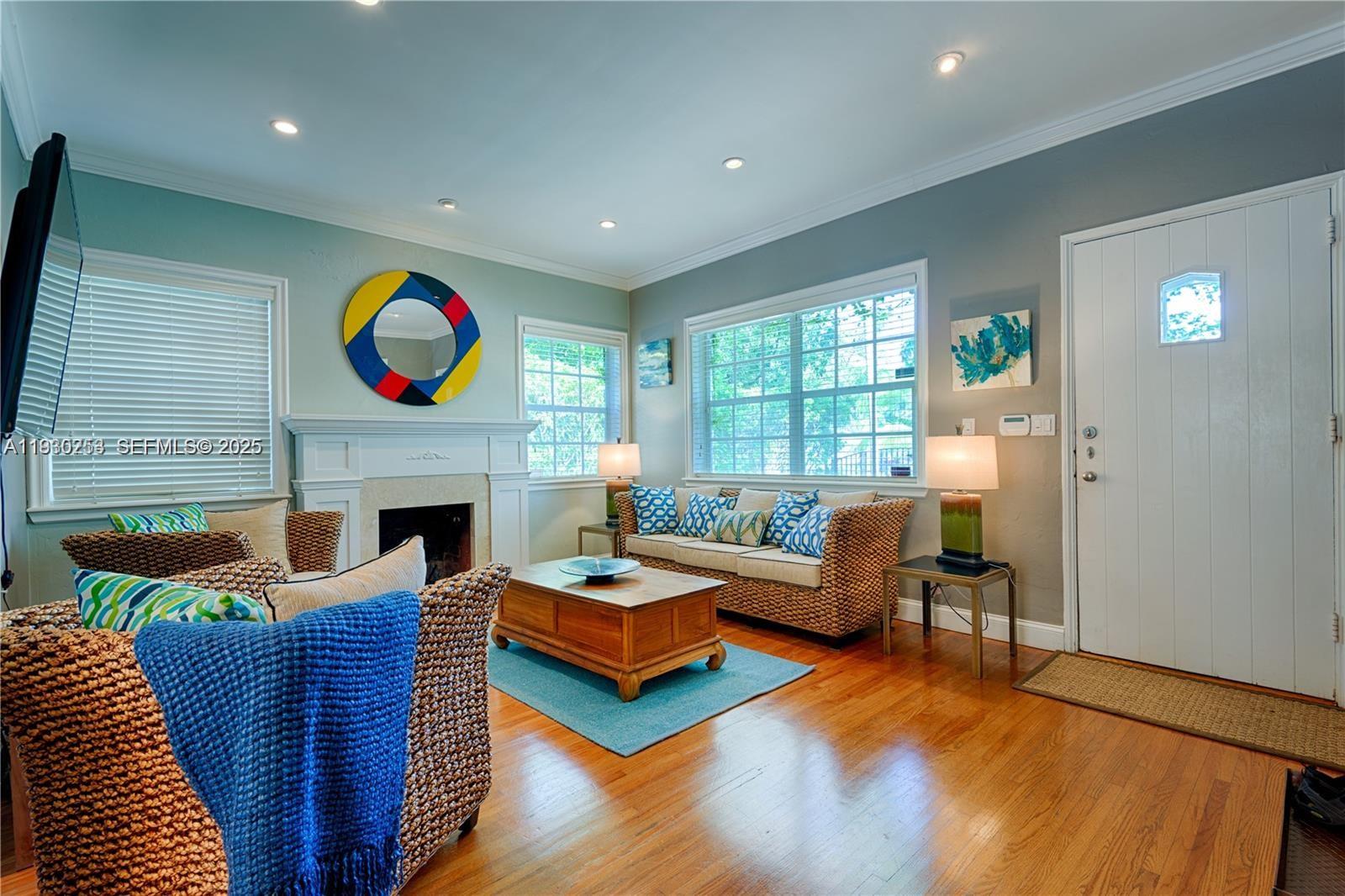 2308 Southwest 23rd Terrace Miami, FL 33145 - Photo 3 of 27 a living room with fireplace furniture and a fireplace