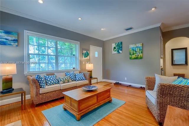 a living room with furniture rug and window