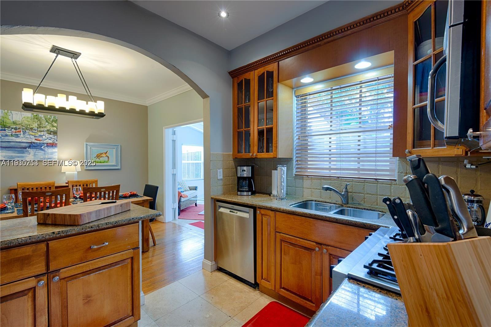 2308 Southwest 23rd Terrace Miami, FL 33145 - Photo 8 of 27 a kitchen that has a lot of cabinets in it