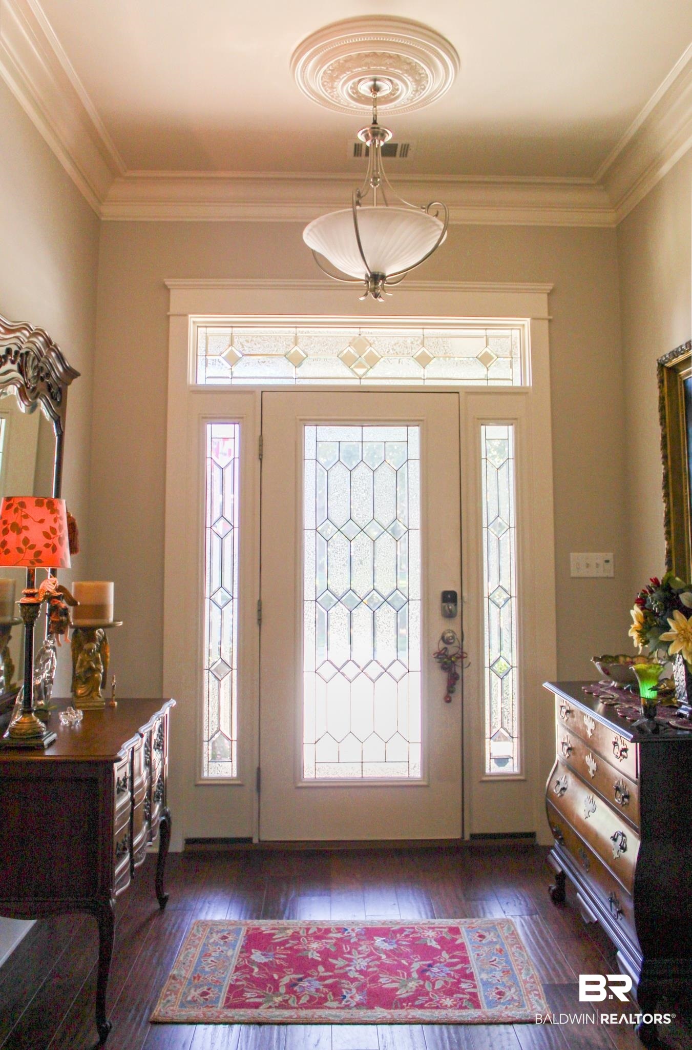 375 Barndling Street Fairhope, AL 36532 - Photo 7 of 24 Foyer entrance with dark hardwood / wood-style floors and ornamental molding