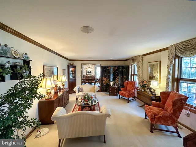 a living room with furniture window and a table