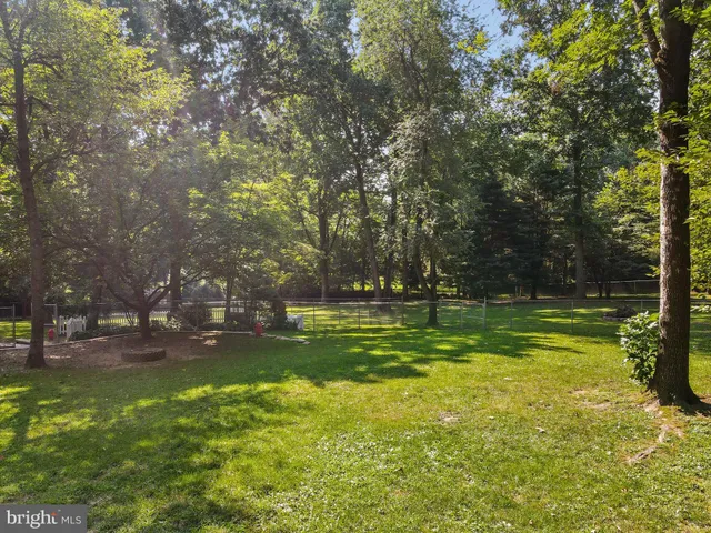 a front view of a house with a yard table and chairs