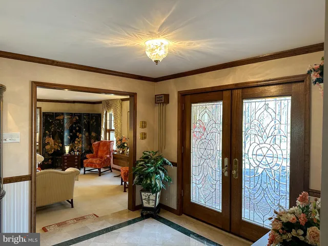 a front door view of a door and a window