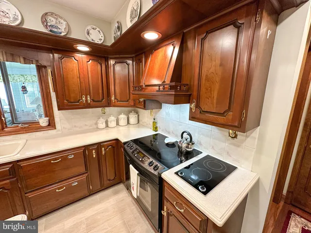 a view of a kitchen with a sink and cabinets