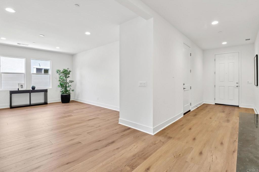 3521 Butler Place Escondido, CA 92027 - Photo 32 of 50 a view of a big room with wooden floor and windows