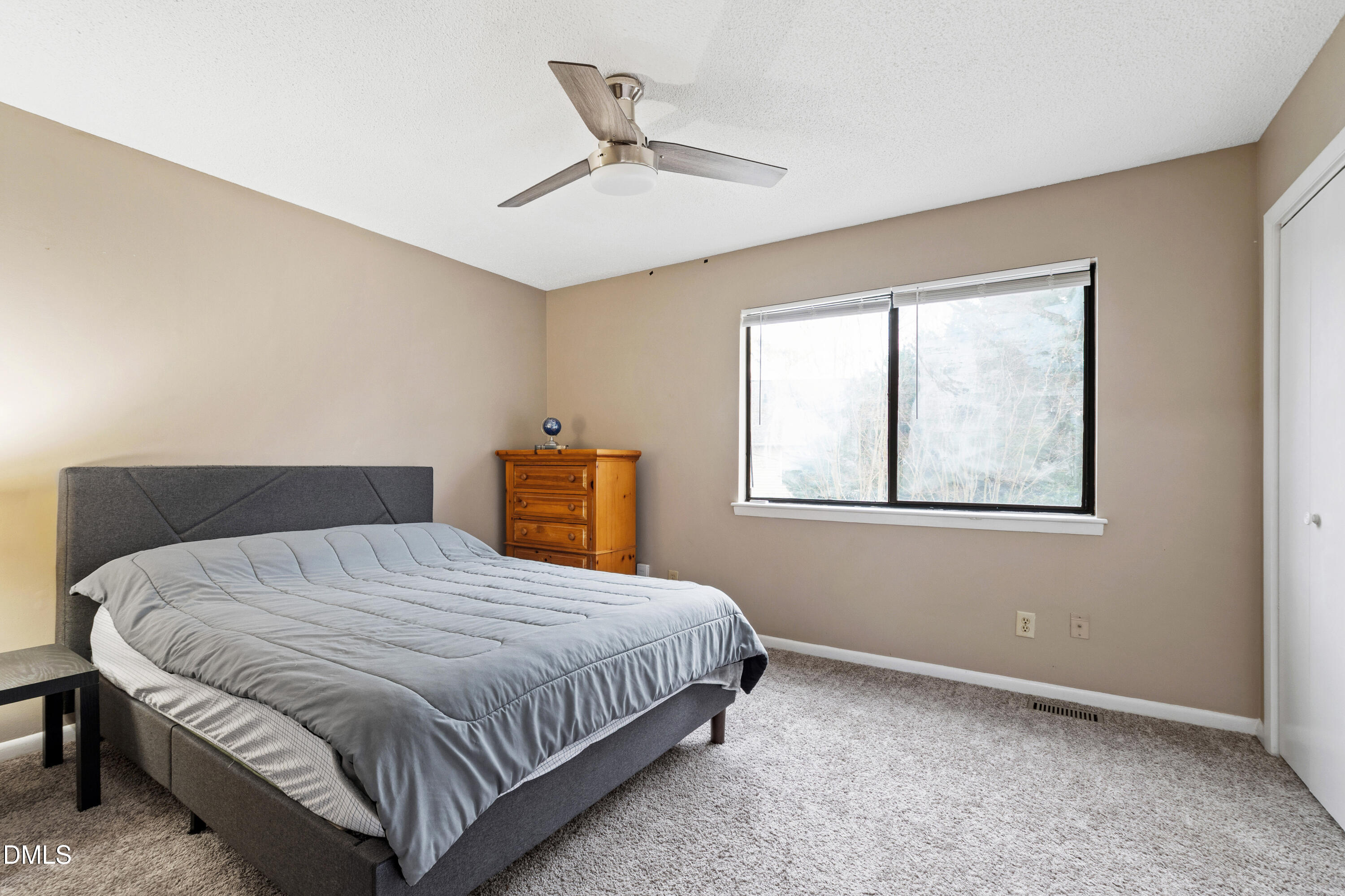 5810 Shady Grove Circle Raleigh, NC 27609 - Photo 11 of 21 a bedroom with a bed and window