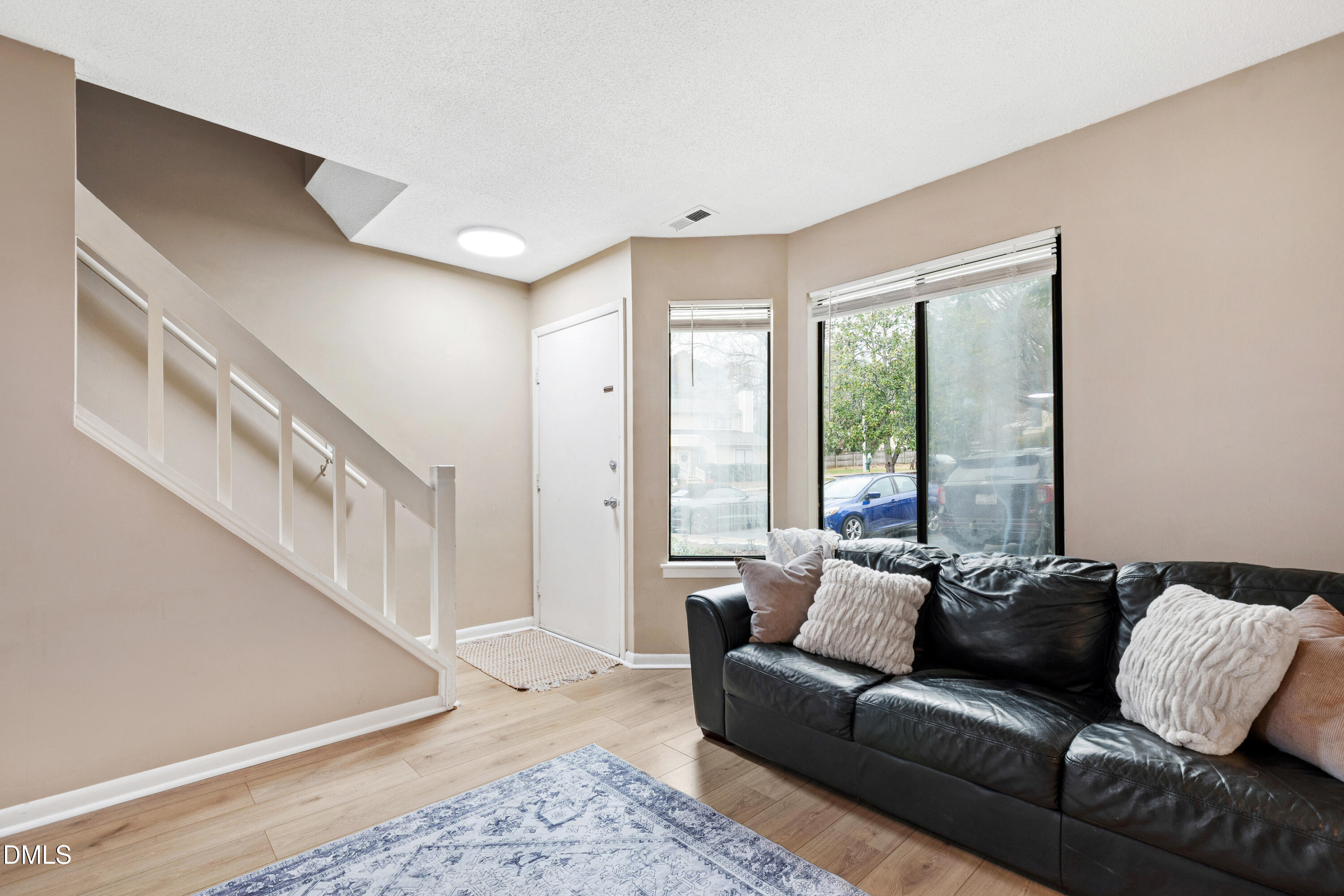 5810 Shady Grove Circle Raleigh, NC 27609 - Photo 11 of 21 a living room with furniture and a window