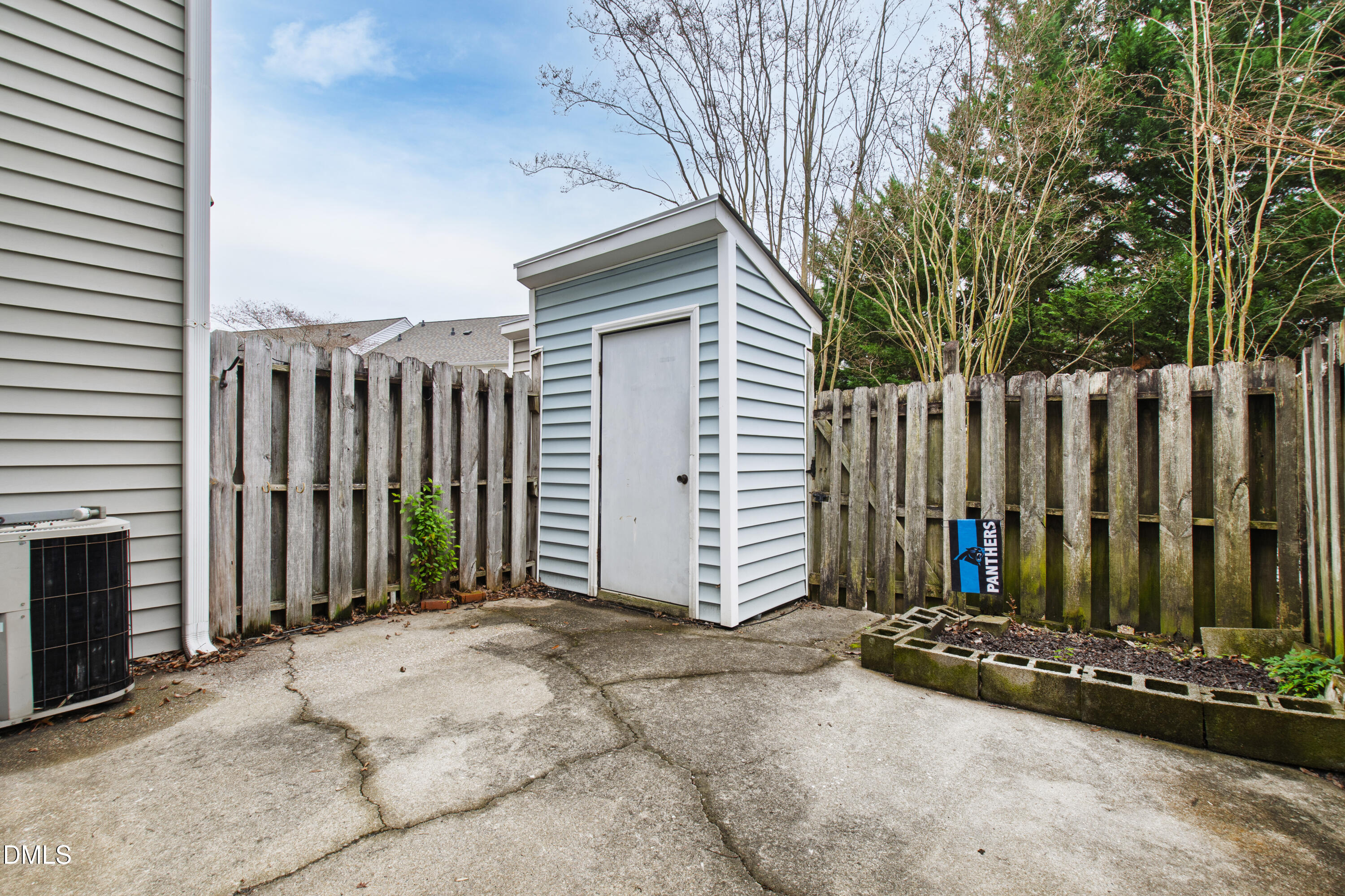 5810 Shady Grove Circle Raleigh, NC 27609 - Photo 18 of 21 a view of a house with a small yard and wooden fence
