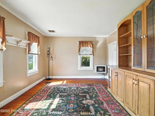 a view of a hallway with windows