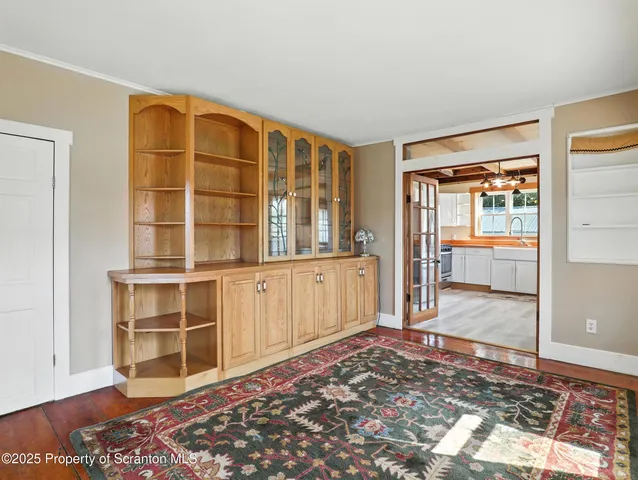 a view of a bedroom with cabinet and door