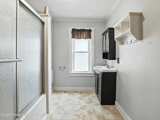 a bathroom with a sink and mirror