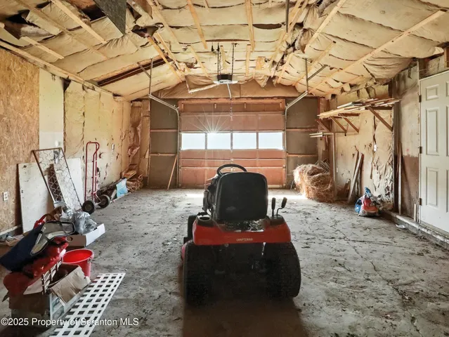 a view of a house with a yard and mountain