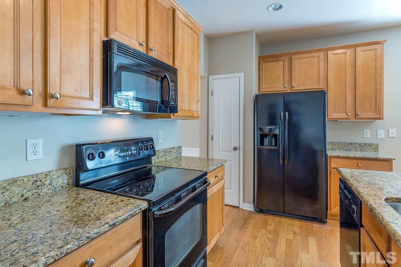 3601 Cathedral Bell Road Raleigh, NC 27614 - Photo 12 of 25 a kitchen with a stove and a microwave