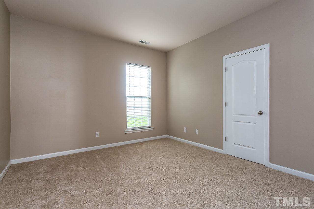 3601 Cathedral Bell Road Raleigh, NC 27614 - Photo 14 of 25 an empty room with windows and closet
