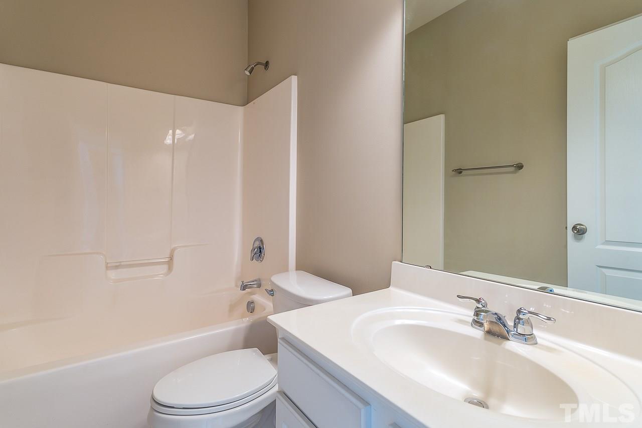3601 Cathedral Bell Road Raleigh, NC 27614 - Photo 15 of 25 a bathroom with a toilet a sink and a bathtub