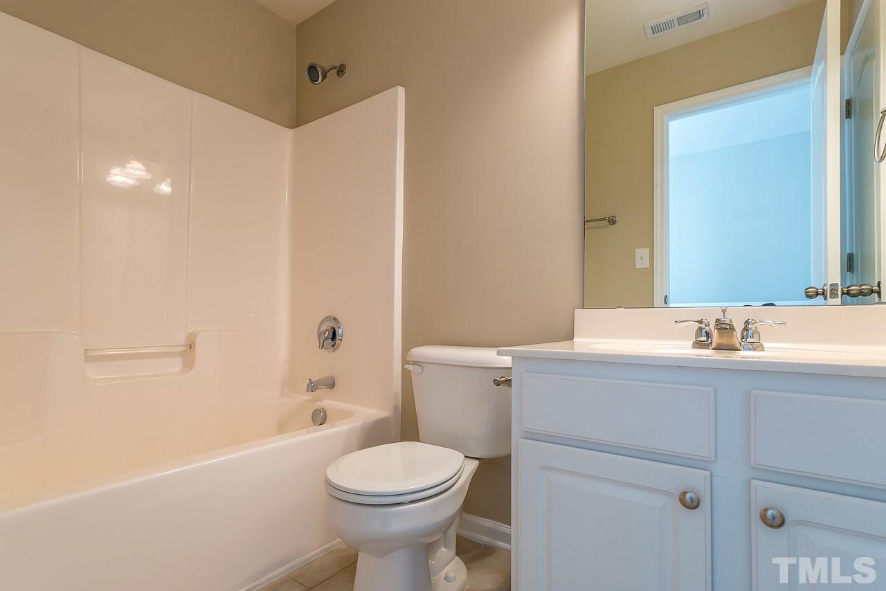 3601 Cathedral Bell Road Raleigh, NC 27614 - Photo 21 of 25 a bathroom with a sink a toilet and shower