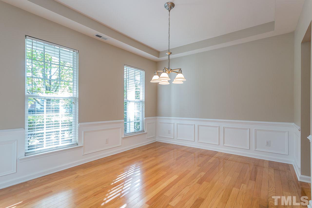3601 Cathedral Bell Road Raleigh, NC 27614 - Photo 4 of 25 a view of an empty room with wooden floor and a window