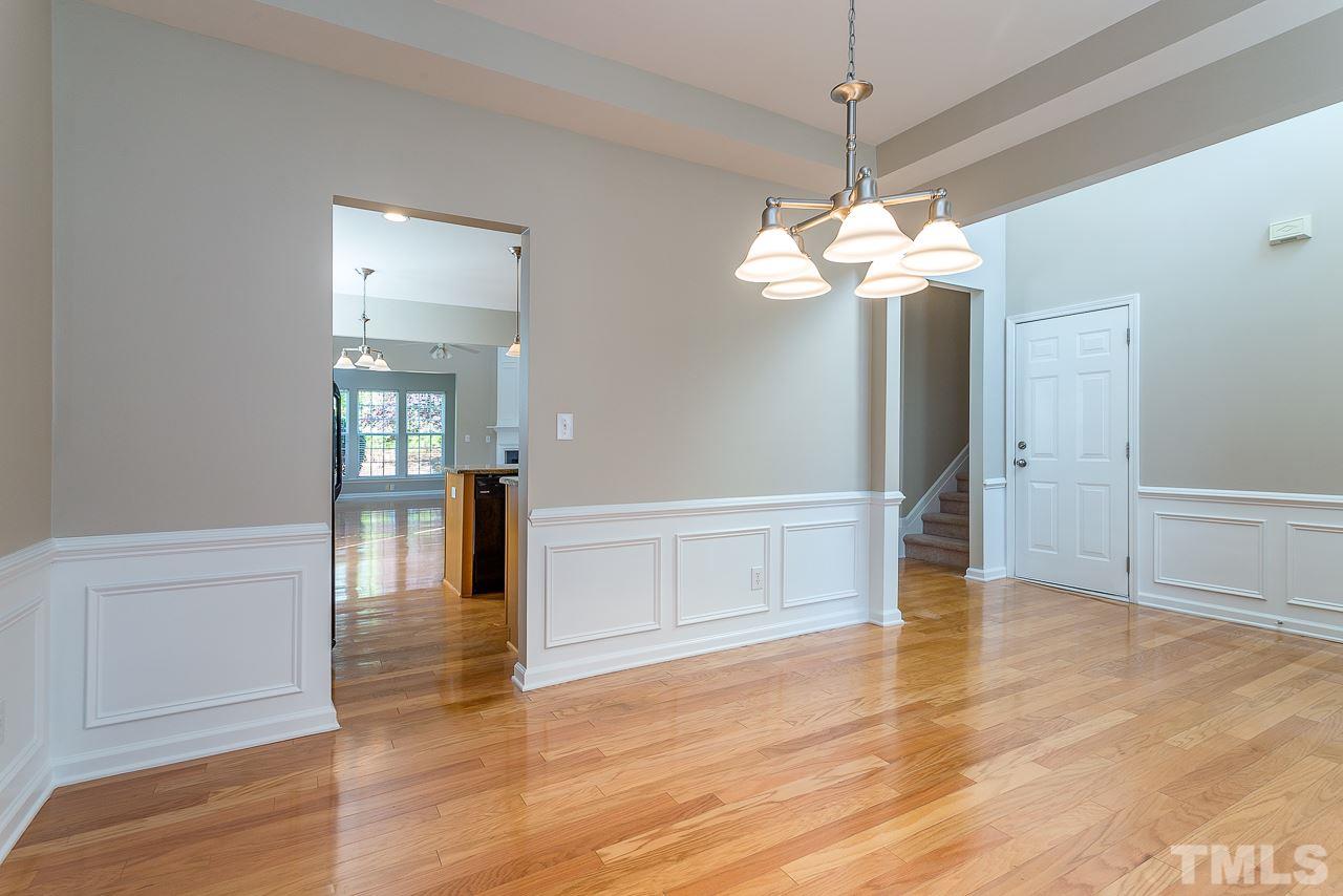 3601 Cathedral Bell Road Raleigh, NC 27614 - Photo 5 of 25 a view of an empty room with window and wooden floor