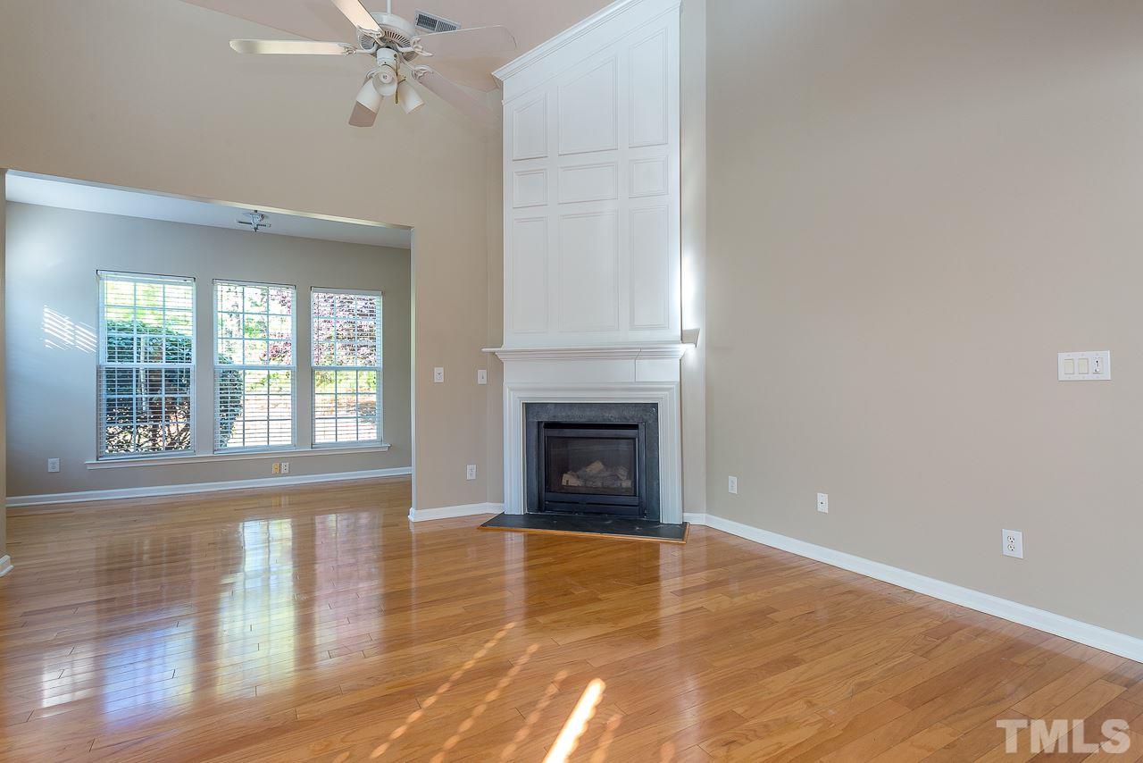 3601 Cathedral Bell Road Raleigh, NC 27614 - Photo 6 of 25 a view of an empty room with wooden floor and a window