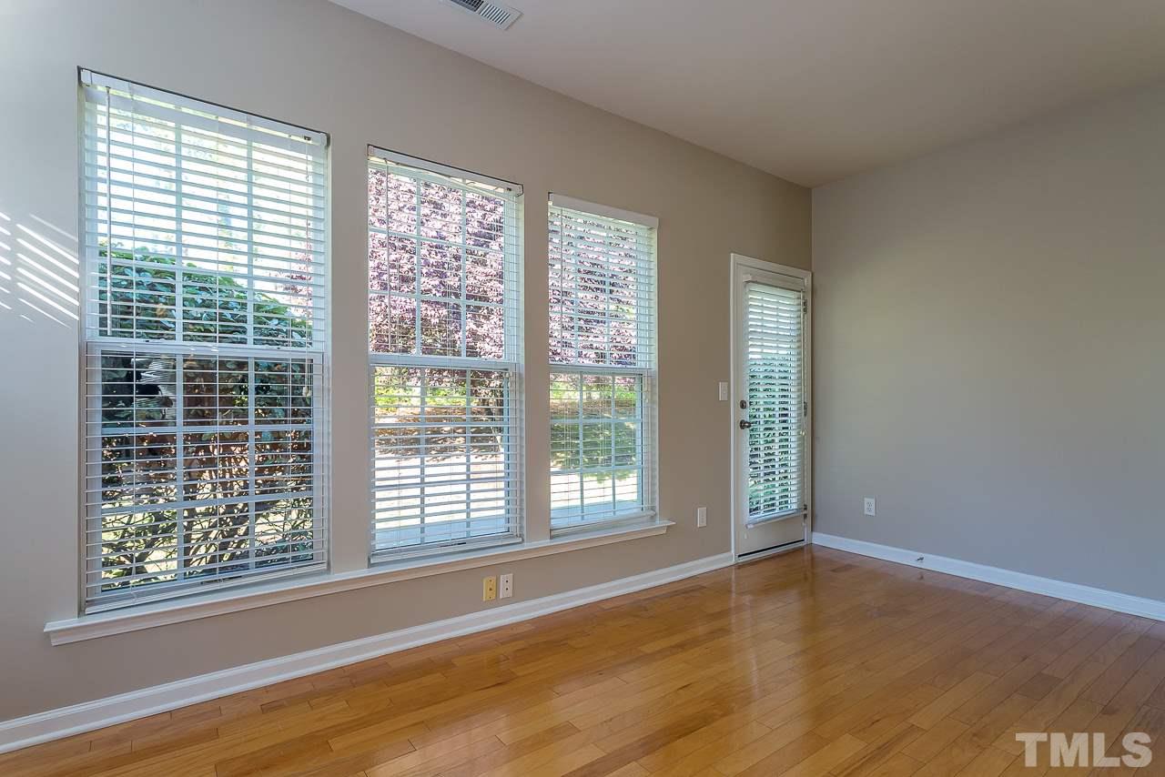 3601 Cathedral Bell Road Raleigh, NC 27614 - Photo 7 of 25 a view of an empty room with wooden floor and a window