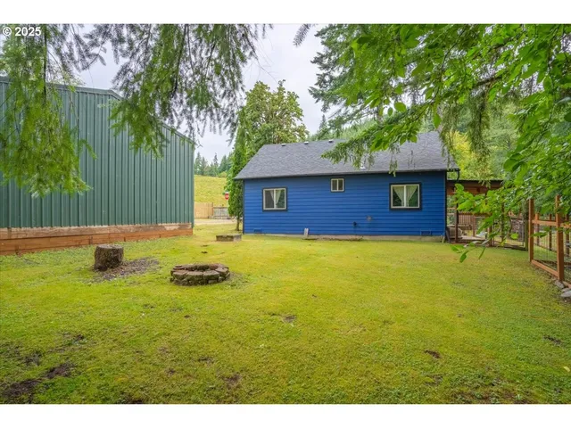 a aerial view of a house with a yard