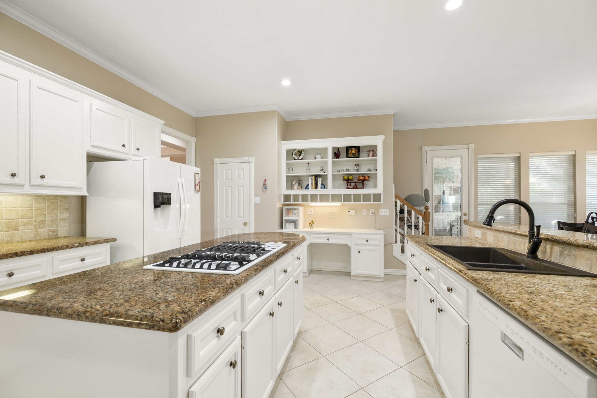 19315 Puget Lane Spring, TX 77388 - Photo 15 of 49 a kitchen with stainless steel appliances granite countertop a sink stove and cabinets