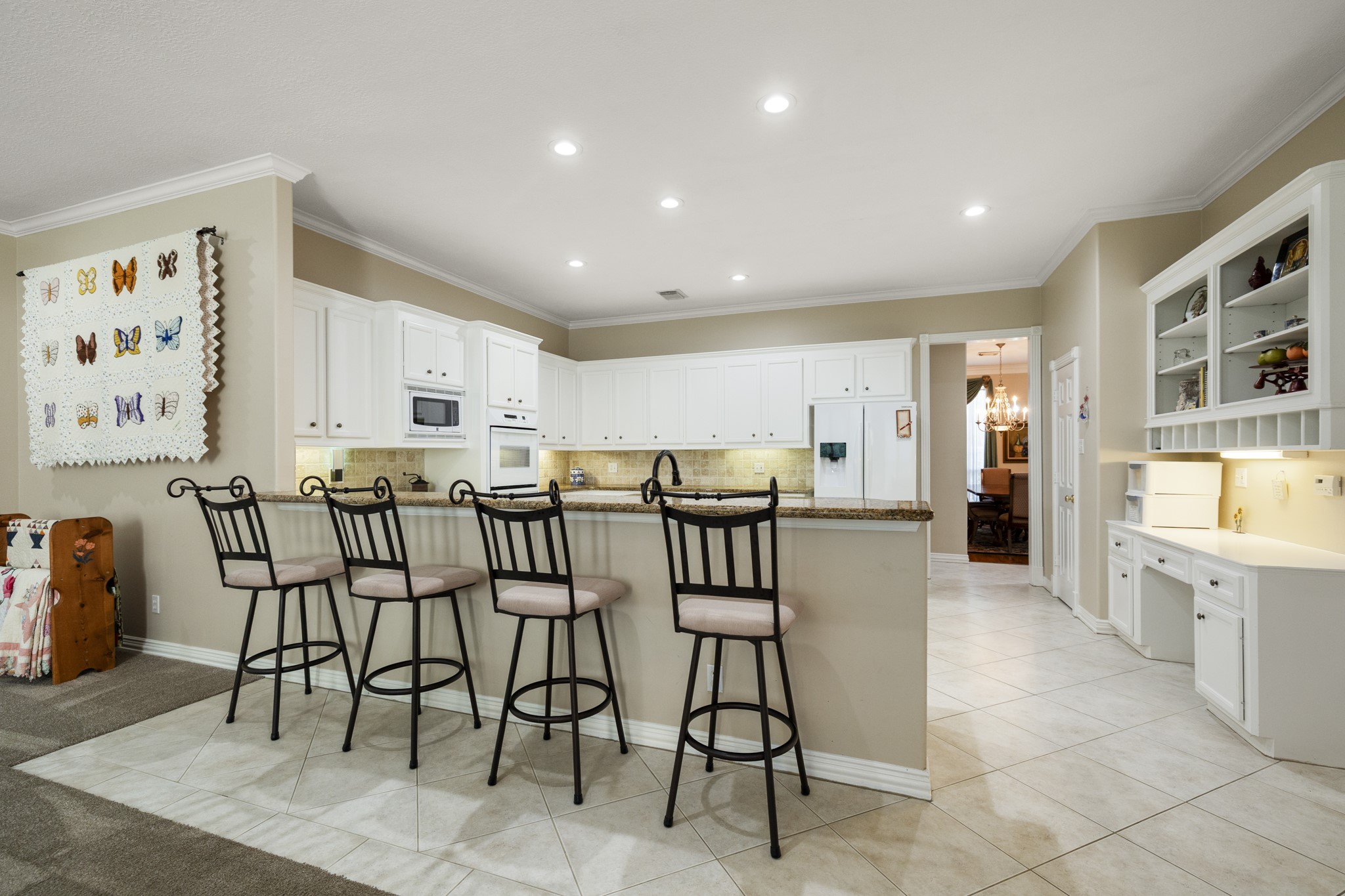 19315 Puget Lane Spring, TX 77388 - Photo 19 of 49 a dining hall with stainless steel appliances a dining table and chairs