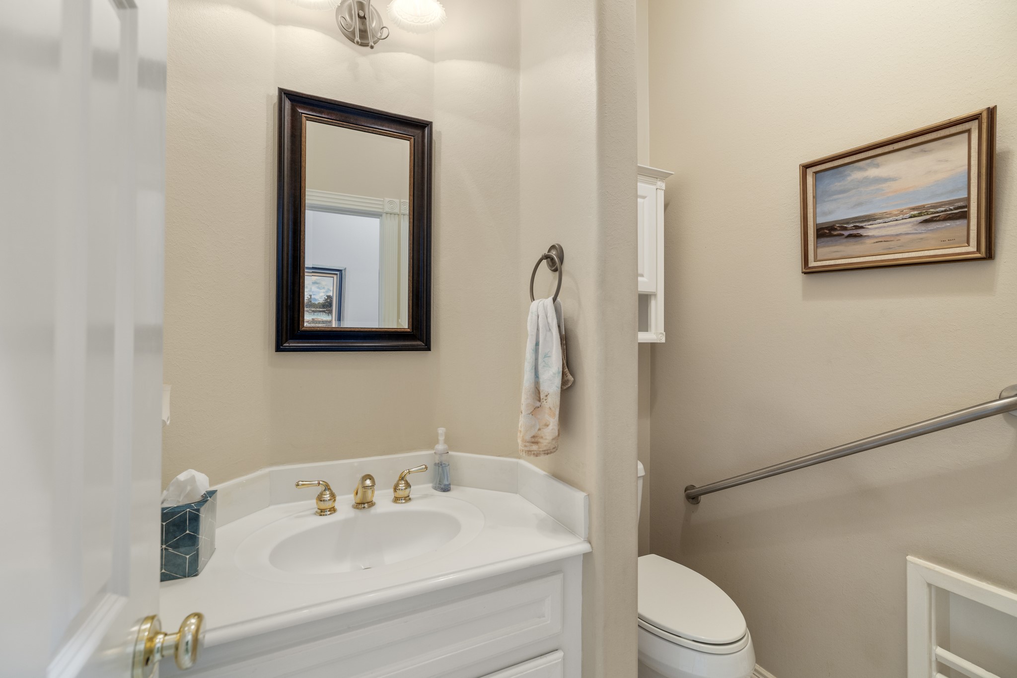 19315 Puget Lane Spring, TX 77388 - Photo 22 of 49 a bathroom with a toilet a sink and mirror