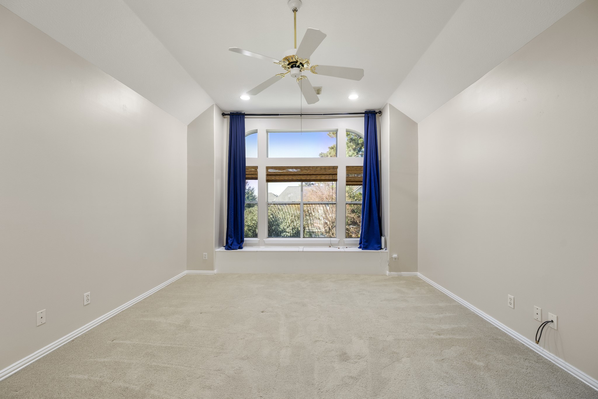 19315 Puget Lane Spring, TX 77388 - Photo 24 of 49 an empty room with windows and a ceiling fan