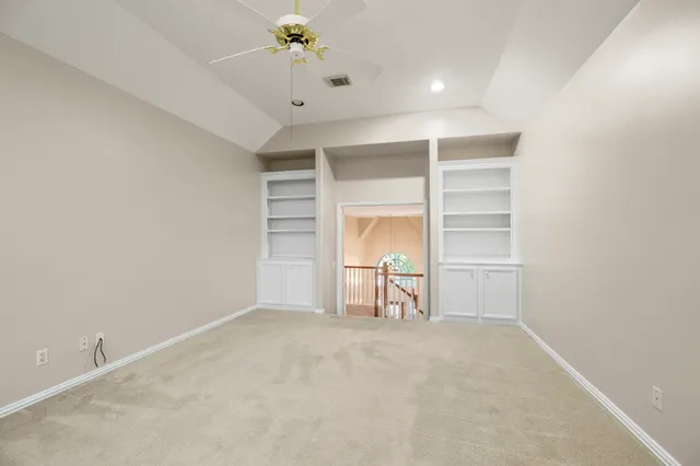a bathroom with a double vanity sink toilet and a mirror