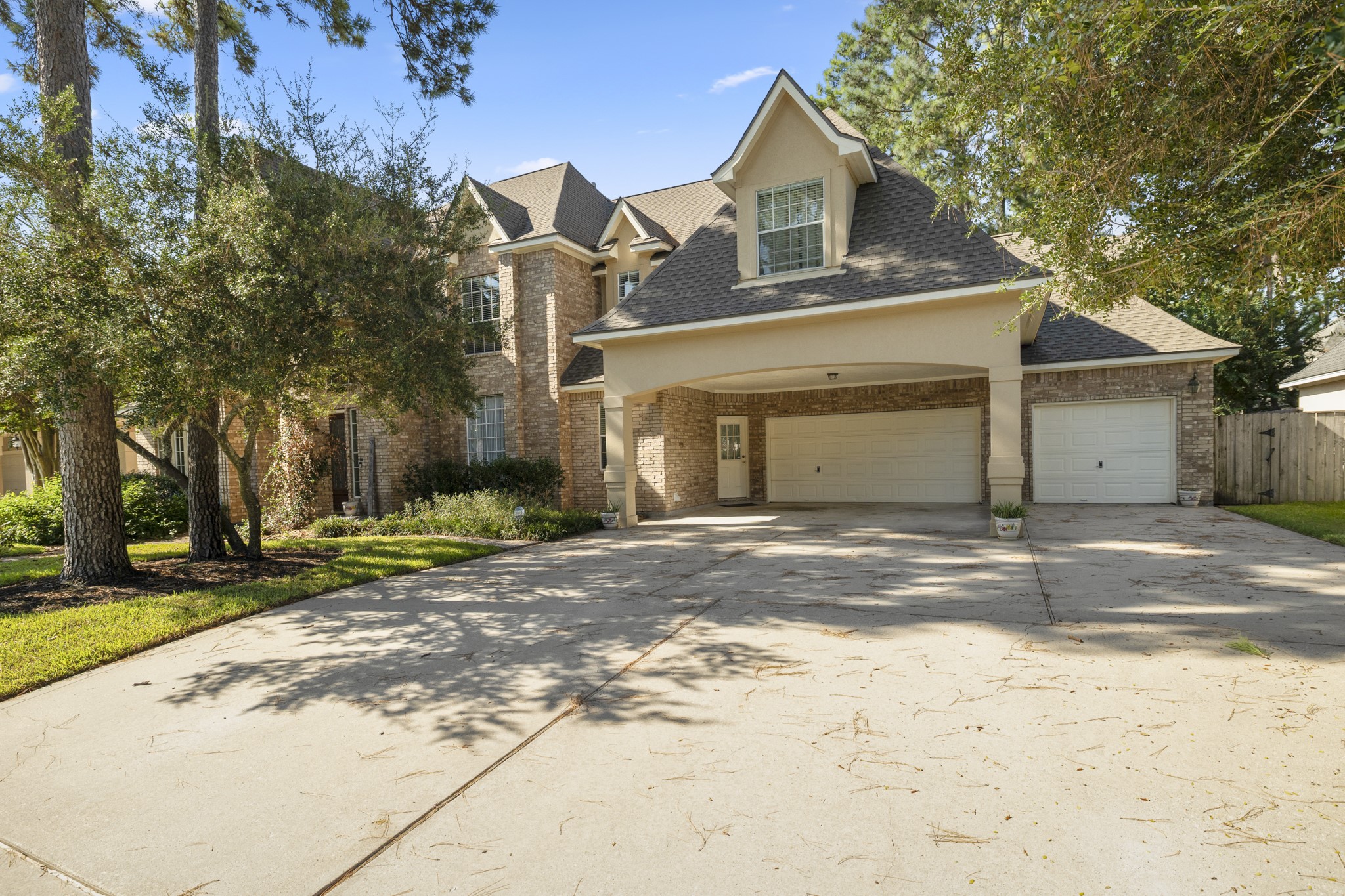 19315 Puget Lane Spring, TX 77388 - Photo 3 of 49 a front view of a house with a yard and garage