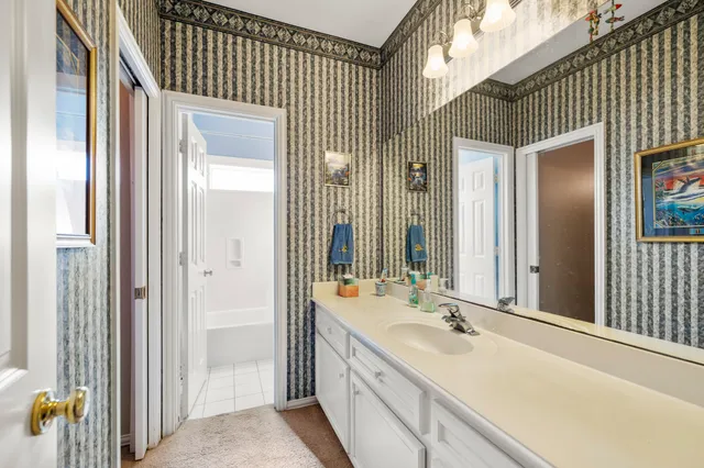 a view of a bathroom with a shower and closet