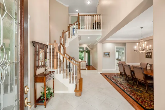 a view of a hallway with furniture