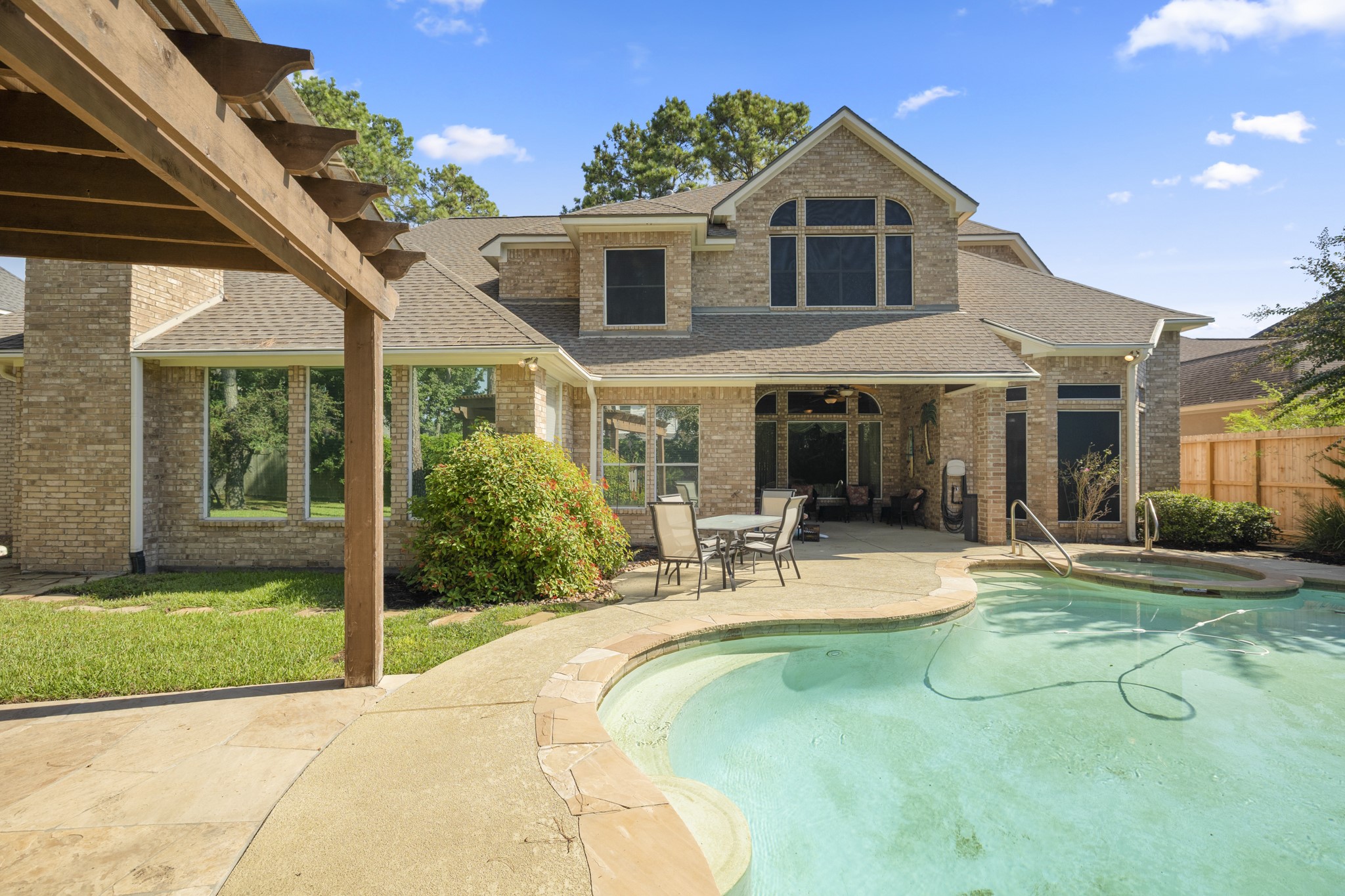 19315 Puget Lane Spring, TX 77388 - Photo 42 of 49 a front view of a house with a yard table and chairs