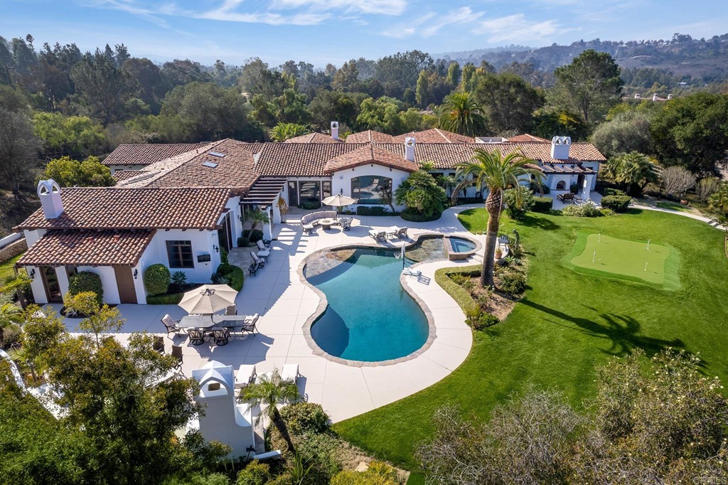 17555 Ranchito Del Rio Rancho Santa Fe, CA 92067 - Photo 1 of 1 an aerial view of residential houses with outdoor space and pool