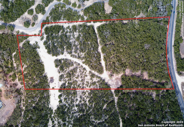22335 Scenic Loop Road San Antonio, TX 78255 - Photo 1 of 1 an aerial view of residential house with outdoor space and trees all around